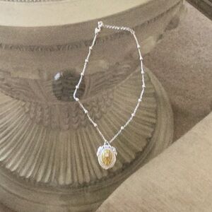 Brighton Necklace with faux Pearls on the chain. This Necklace has a Pendant on